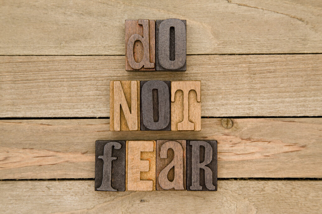 The words "do not fear" spelled out in wooden blocks.