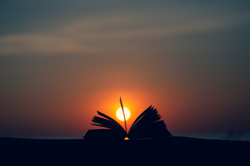 Silhouette of book against sundown.  