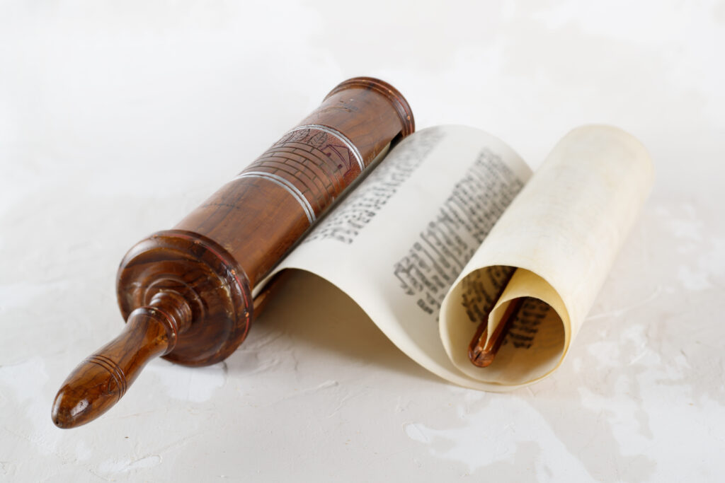 A wooden scroll open over a white background.