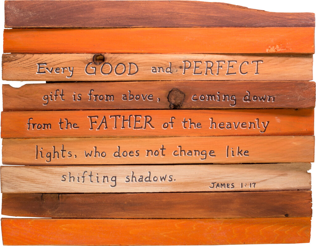 James 1:17 Bible verse written on multicolored wooden planks. 