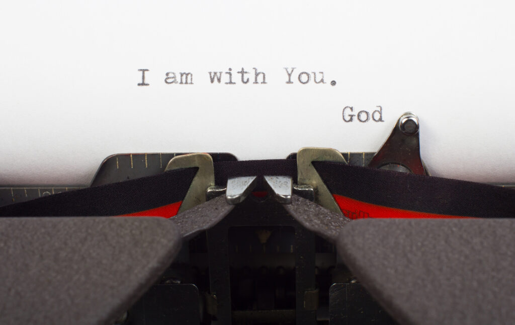 "I am with You" written on a typewriter as a message from God.
